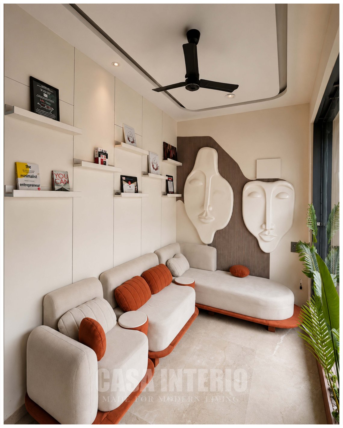 Client lounge with cream sofas, terracotta cushions and sculpted face panels